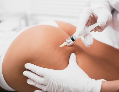 Beautician doing Injection into female buttocks, body mesotherapy